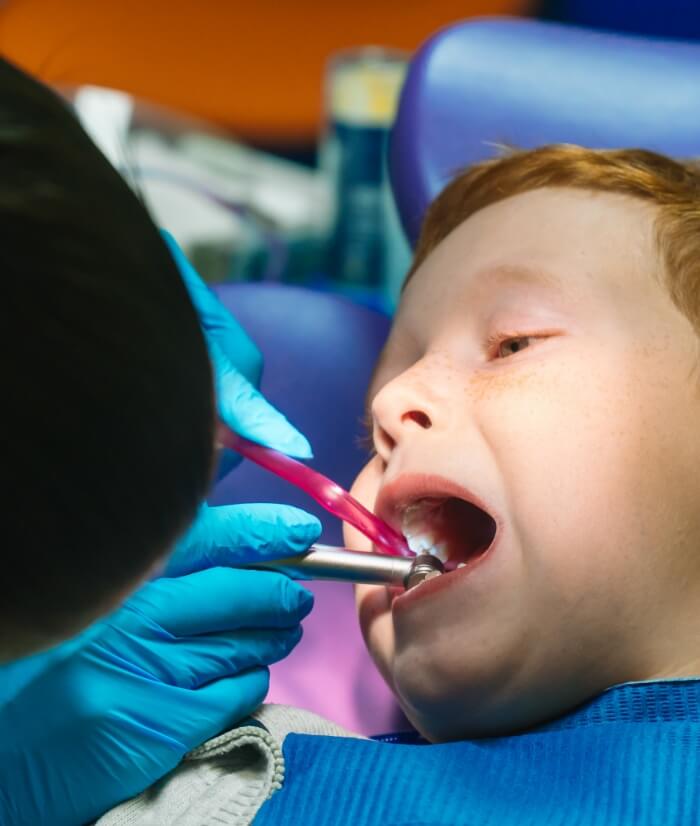 Child receiving emergency dental care