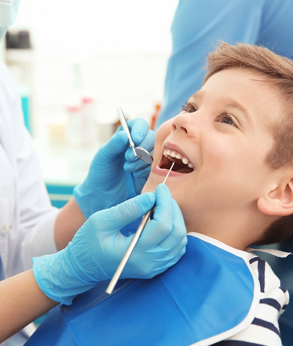 a child having his mouth examined