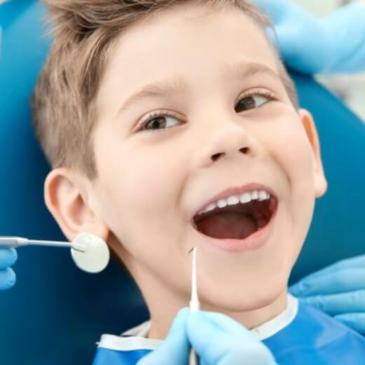 Child receiving restorative dentistry treatment