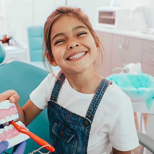 Little girl smiling after a dental checkup and cleaning in Papillion