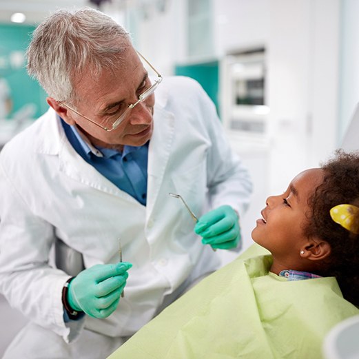 child visiting dentist for checkup 