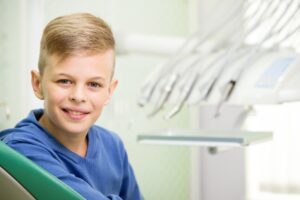 Smiling boy in dentist’s chair